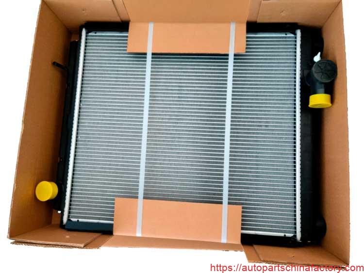New Mitsubishi Fuso Canter radiator securely packaged in a heavy-duty export carton with protective bracing.